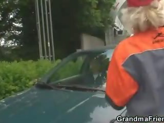 Blond granny has threesome outdoors